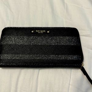 Kate Spade zip around large wallet. Black and silver stripped.